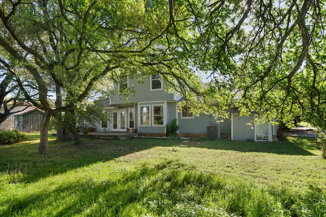 13212 Running Doe Ln, Cedar Park, TX 78613 - back of house with french doors and a lawn