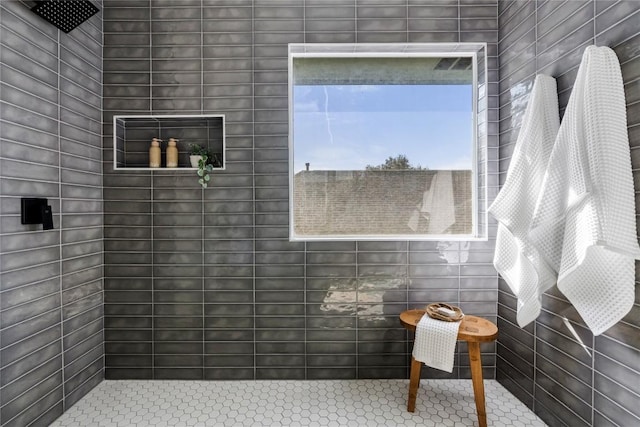bathroom with a tile shower