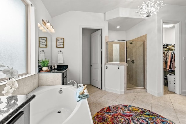 174 Challis Ct, Austin, TX 78737 - bathroom featuring a shower stall, a garden tub, a walk in closet, vanity, and baseboards