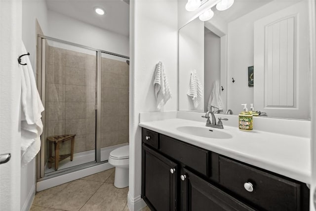 174 Challis Ct, Austin, TX 78737 - full bathroom with vanity, toilet, a shower stall, tile patterned floors, and recessed lighting