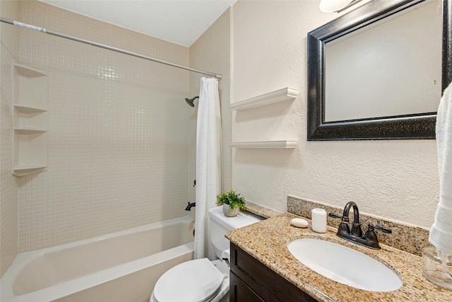 full bath featuring a textured wall, shower / bath combination with curtain, vanity, and toilet