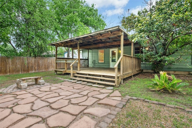 exterior space featuring a wooden deck and fence