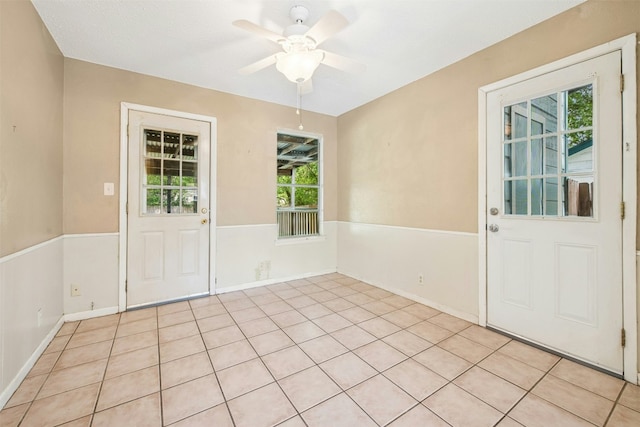 interior space featuring ceiling fan