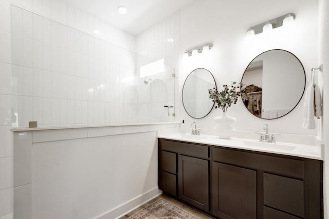 653 Texas Sage Loop, Buda, TX 78610 - bathroom with double vanity and a walk in shower