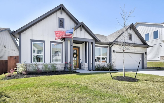653 Texas Sage Loop, Buda, TX 78610 - modern farmhouse with board and batten siding, an attached garage, concrete driveway, and stone siding