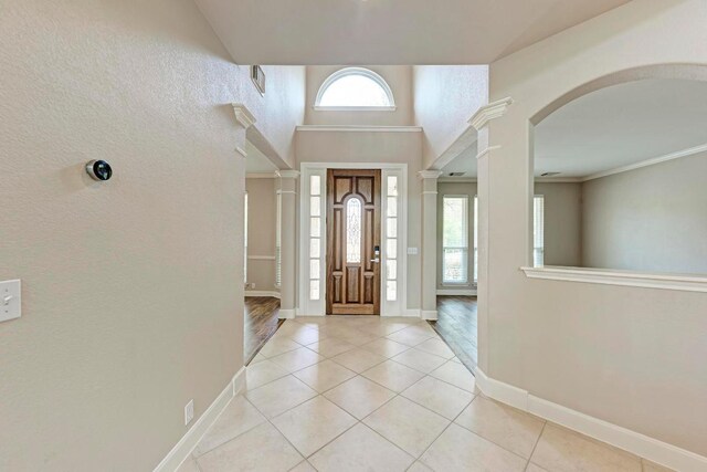 8105 Endeavor Cir, Austin, TX 78726 - entryway with light tile patterned floors and arched walkways