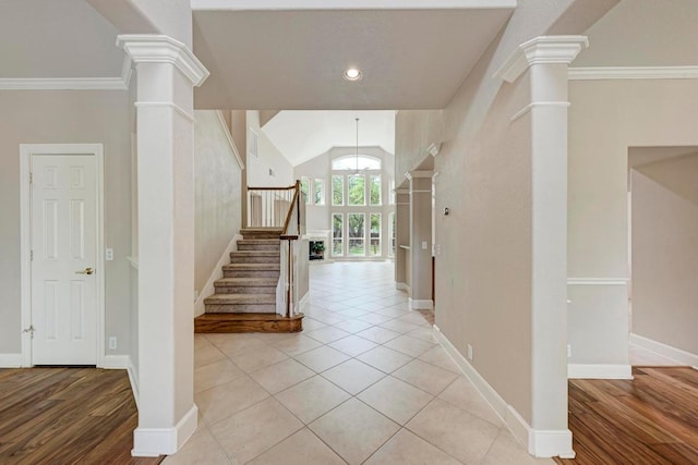 8105 Endeavor Cir, Austin, TX 78726 - foyer featuring stairs, lofted ceiling, ornate columns, light wood finished floors, and ornamental molding