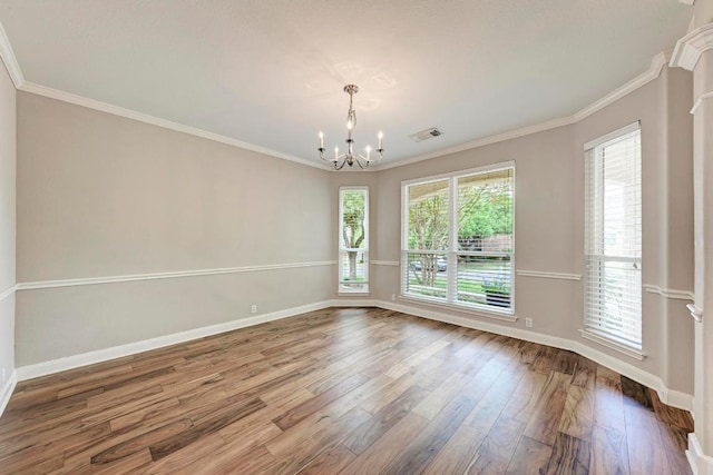 8105 Endeavor Cir, Austin, TX 78726 - empty room featuring a chandelier, wood finished floors, and crown molding