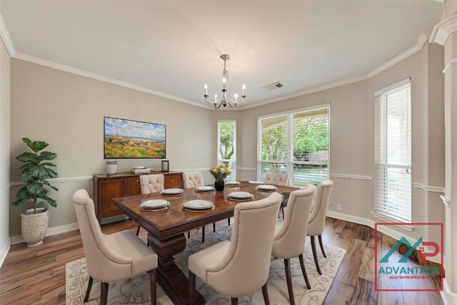 8105 Endeavor Cir, Austin, TX 78726 - dining area featuring a chandelier, light wood finished floors, and ornamental molding
