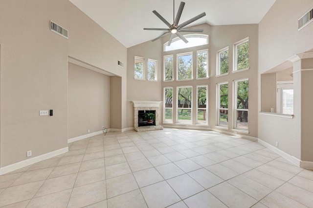 8105 Endeavor Cir, Austin, TX 78726 - unfurnished living room featuring ceiling fan, light tile patterned flooring, high vaulted ceiling, and a brick fireplace