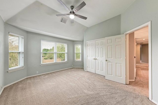 8105 Endeavor Cir, Austin, TX 78726 - unfurnished bedroom with carpet floors, lofted ceiling, multiple windows, and a closet