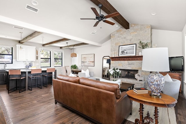 18105 Austin Blvd, Lago Vista, TX 78645 - living room with a fireplace, dark wood-style floors, ceiling fan, healthy amount of natural light, and recessed lighting