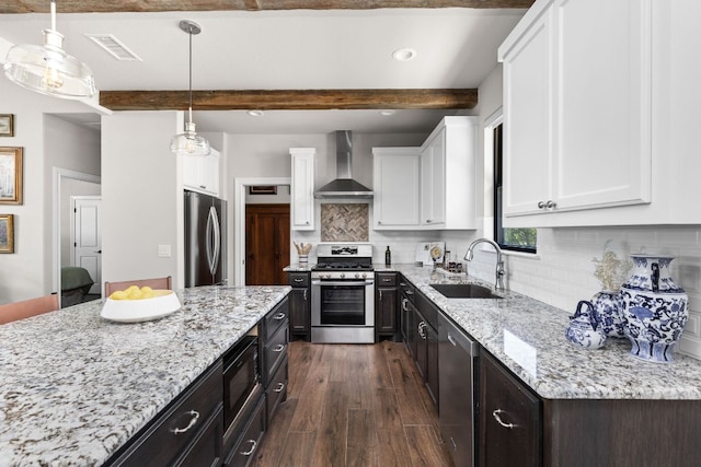 18105 Austin Blvd, Lago Vista, TX 78645 - kitchen with wall chimney range hood, appliances with stainless steel finishes, beamed ceiling, white cabinets, and dark wood-style flooring