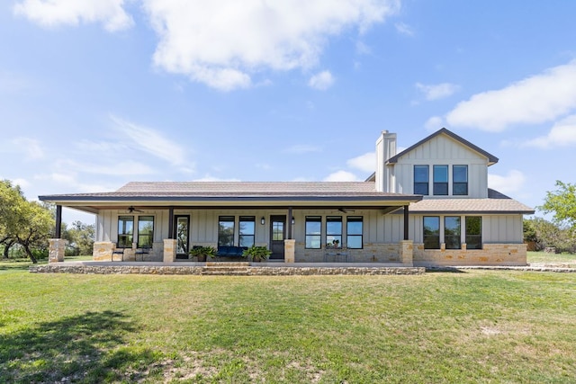18105 Austin Blvd, Lago Vista, TX 78645 - rear view of property featuring a ceiling fan, roof with shingles, a yard, and board and batten siding