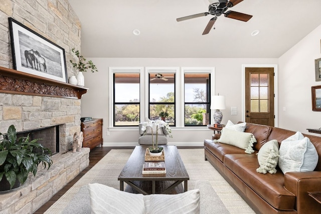 18105 Austin Blvd, Lago Vista, TX 78645 - living area with vaulted ceiling, a ceiling fan, a fireplace, and wood finished floors