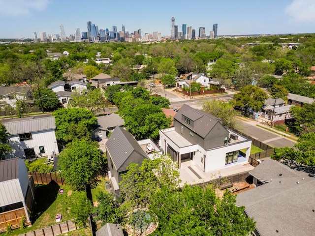 birds eye view of property featuring a residential view and a view of city
