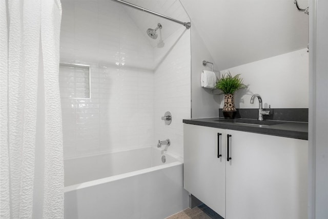 full bathroom with vanity, shower / bathtub combination with curtain, and lofted ceiling
