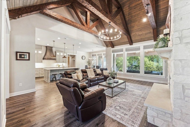 3204 Whitt Creek Trl, Leander, TX 78641 - living room featuring high vaulted ceiling, baseboards, a chandelier, wood finished floors, and wood ceiling with exposed beams