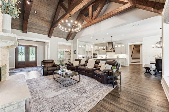 3204 Whitt Creek Trl, Leander, TX 78641 - living room featuring a chandelier, stairway, high vaulted ceiling, beam ceiling, and dark wood finished floors