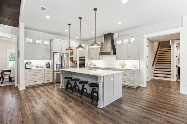 3204 Whitt Creek Trl, Leander, TX 78641 - kitchen featuring appliances with stainless steel finishes, custom range hood, a sink, tasteful backsplash, and recessed lighting