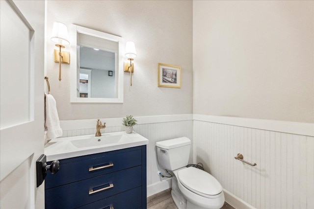 3204 Whitt Creek Trl, Leander, TX 78641 - bathroom featuring a wainscoted wall, vanity, and wood finished floors