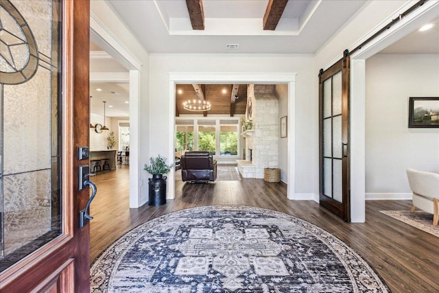 3204 Whitt Creek Trl, Leander, TX 78641 - entryway featuring wood finished floors, a chandelier, and a barn door