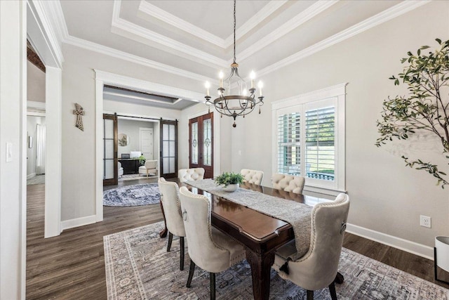 3204 Whitt Creek Trl, Leander, TX 78641 - dining room featuring healthy amount of natural light, dark wood-style flooring, a barn door, a chandelier, and crown molding