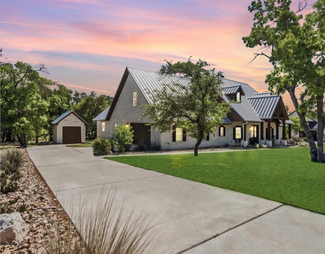 3204 Whitt Creek Trl, Leander, TX 78641 - modern inspired farmhouse featuring a standing seam roof, a detached garage, an outdoor structure, and driveway