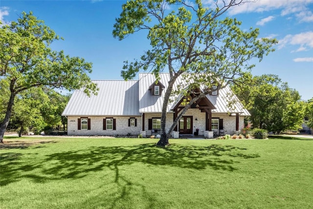 3204 Whitt Creek Trl, Leander, TX 78641 - view of front of property featuring a front yard, stone siding, and metal roof