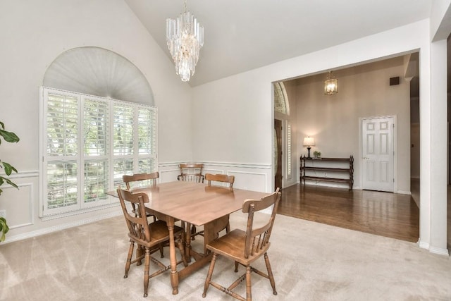 200 Nicole Way, Georgetown, TX 78633 - dining room featuring a chandelier, light colored carpet, and high vaulted ceiling