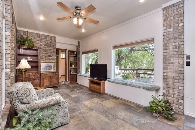 200 Nicole Way, Georgetown, TX 78633 - living area with stone tile flooring, ceiling fan, recessed lighting, and ornamental molding