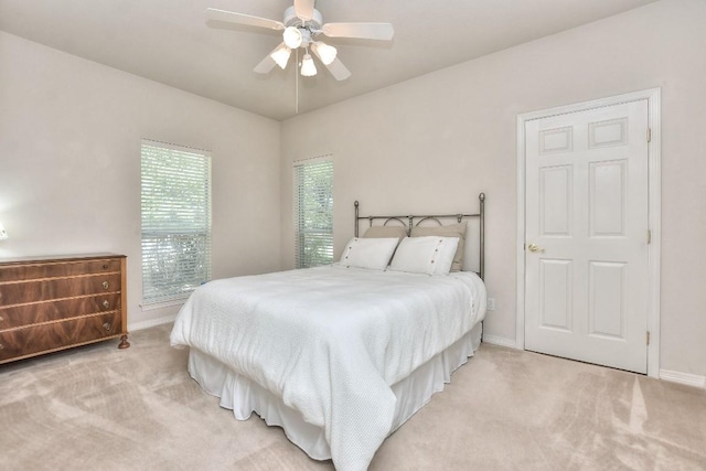 200 Nicole Way, Georgetown, TX 78633 - bedroom with light carpet, baseboards, and ceiling fan