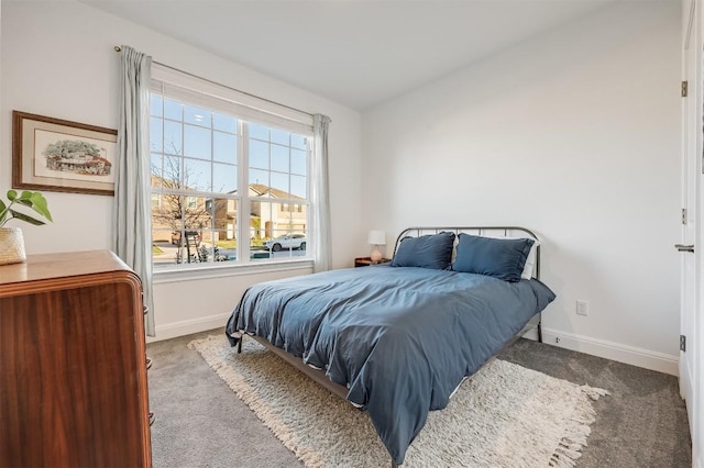 bedroom featuring carpet flooring and baseboards