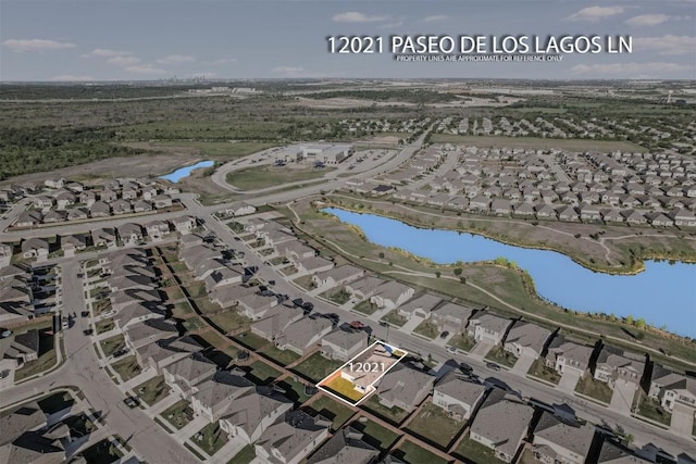 bird's eye view featuring a water view and a residential view