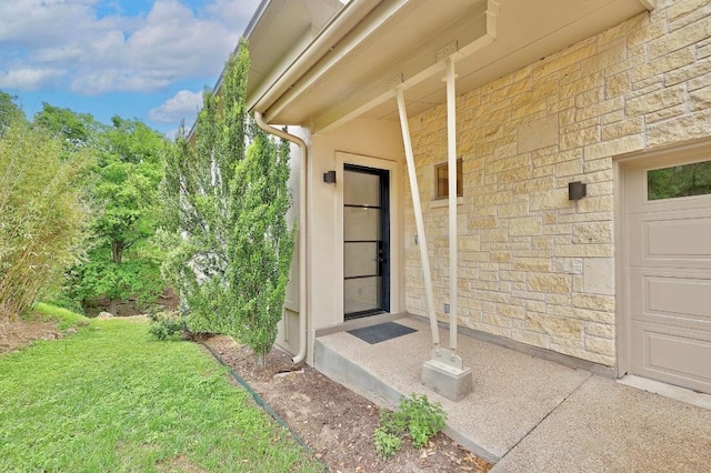 603 Westwood Ter, Austin, TX 78746 - doorway to property featuring stone siding and a lawn