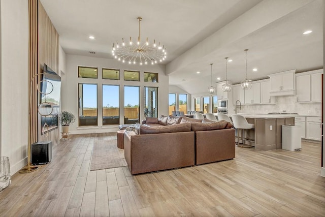 518 Bay Breeze Dr, Kyle, TX 78640 - living area with a chandelier, light wood-style flooring, and recessed lighting