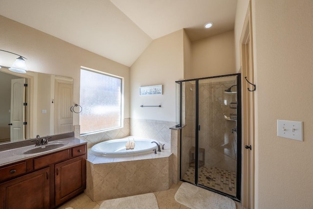 full bathroom with a bath, tile patterned flooring, vaulted ceiling, a stall shower, and vanity