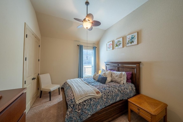 bedroom featuring carpet flooring, a ceiling fan, and lofted ceiling