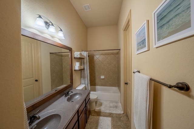 2705 Sixpence Ln, Pflugerville, TX 78660 - full bath with toilet, double vanity, a textured wall, and shower / bath combination with curtain