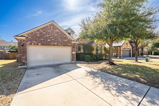 2705 Sixpence Ln, Pflugerville, TX 78660 - view of front facade featuring brick siding and concrete driveway