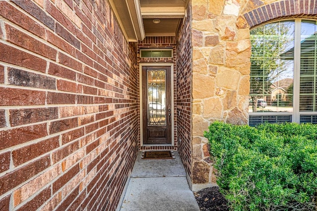 2705 Sixpence Ln, Pflugerville, TX 78660 - property entrance featuring stone siding and brick siding