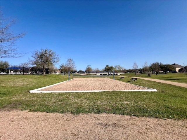 view of community with a yard and volleyball court