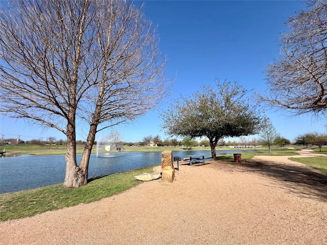 surrounding community with a water view
