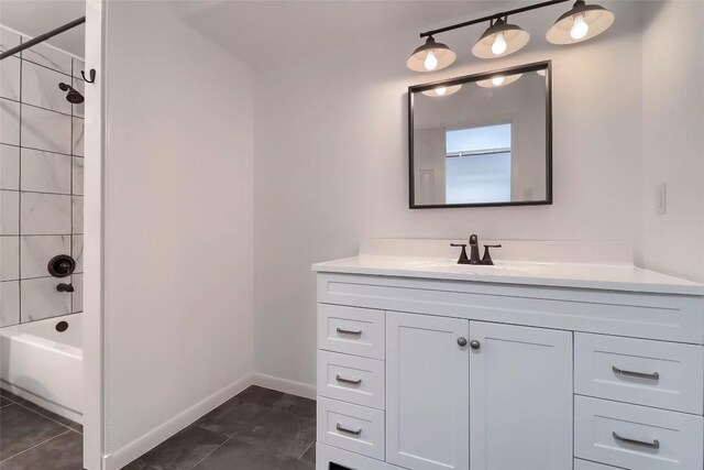full bath featuring baseboards, bathtub / shower combination, and vanity