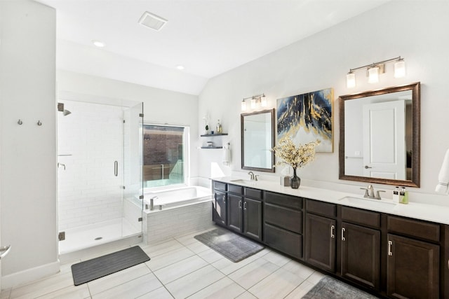 128 Mountain Lion Rd, Georgetown, TX 78628 - full bathroom featuring double vanity, a garden tub, a shower stall, lofted ceiling, and tile patterned floors