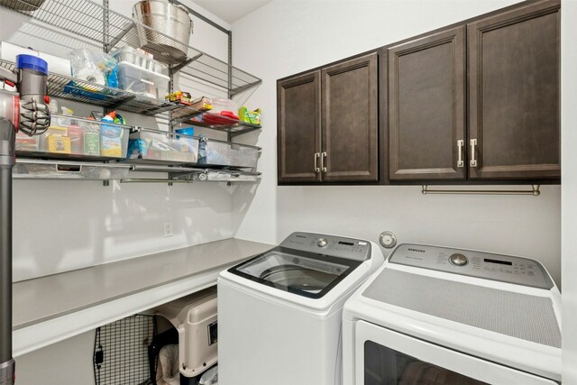 128 Mountain Lion Rd, Georgetown, TX 78628 - laundry area with cabinet space and independent washer and dryer