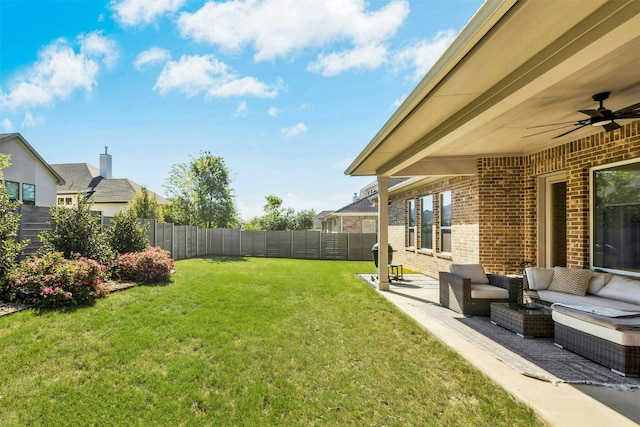 128 Mountain Lion Rd, Georgetown, TX 78628 - fenced backyard featuring a patio, outdoor lounge area, and a ceiling fan