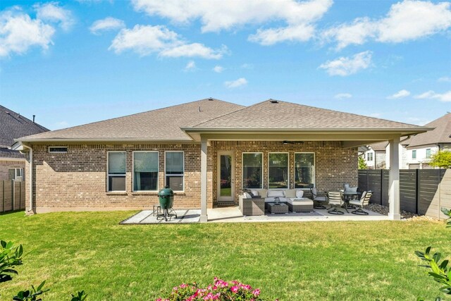 128 Mountain Lion Rd, Georgetown, TX 78628 - back of house featuring brick siding, an outdoor living space, a fenced backyard, and a patio