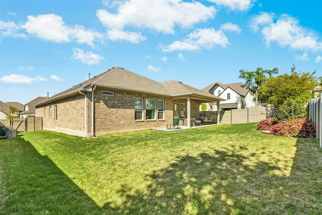 128 Mountain Lion Rd, Georgetown, TX 78628 - rear view of property with brick siding, a patio, and a fenced backyard