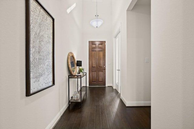 728 Pioneer Grv, Round Rock, TX 78665 - entryway featuring baseboards, dark wood-style floors, and a towering ceiling
